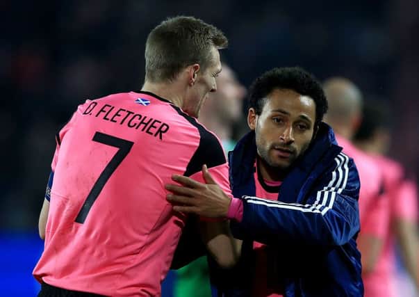 Scotland's Darren Fletcher and Ikechi Anya after the final whistle