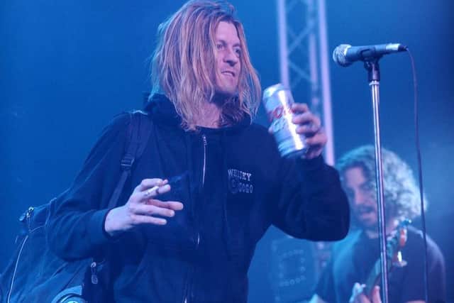 Puddle of Mudd singer Wes Scantlin drinks beer during his band's chaotic gig at Diamond Live Lounge. (Photo: Robin Burns).