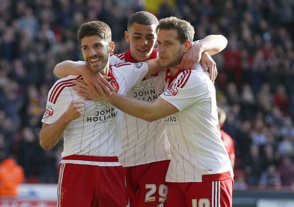 Ryan Flynn of Sheffield Utd celebrates his goal with Che Adams and Billy Sharp