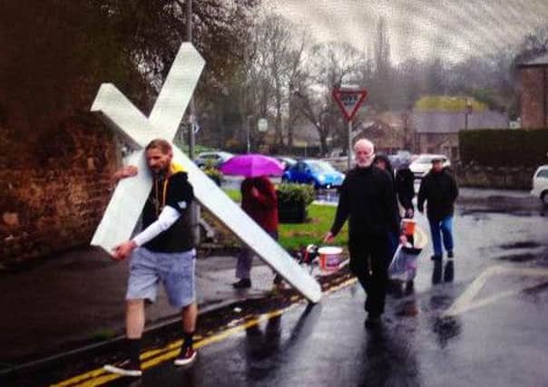 Wayne Hayhurst carried this 100lb crucifix for over 100 miles