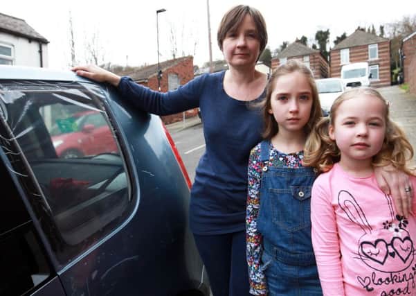A Sheffield mum has spoken of her shock after a rock was thrown through her car window - narrowly missing her two young children who were sitting in the back