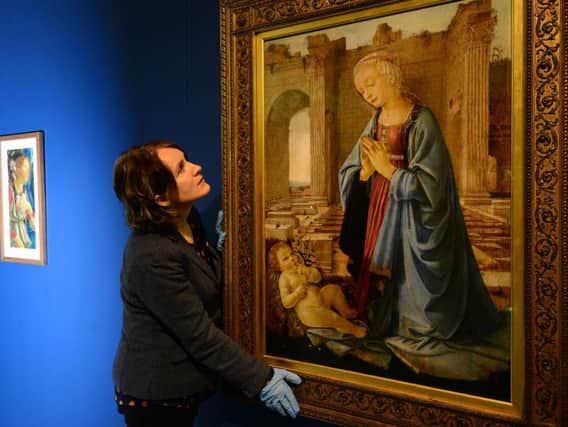 Sheffield Millennium Gallery curator Alison Morton installing Verocchios Virgin Adoring the Christ Child, known as the Ruskin Madonna, on loan from National Galleries of Scotland