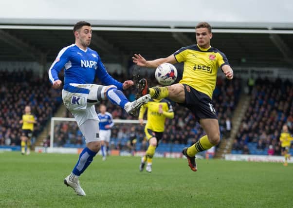 Chesterfield vs Fleetwood Town - Lee Novak battles for the ball with Tyler Forbes of Fleetwood - Pic By James Williamson