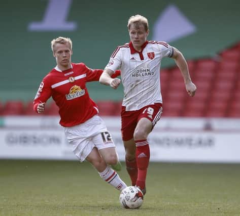 James McEveley gets in front of Lauri Dalla Valle of Crewe Alexandra during the Sky Bet League One match at Bramall Lane