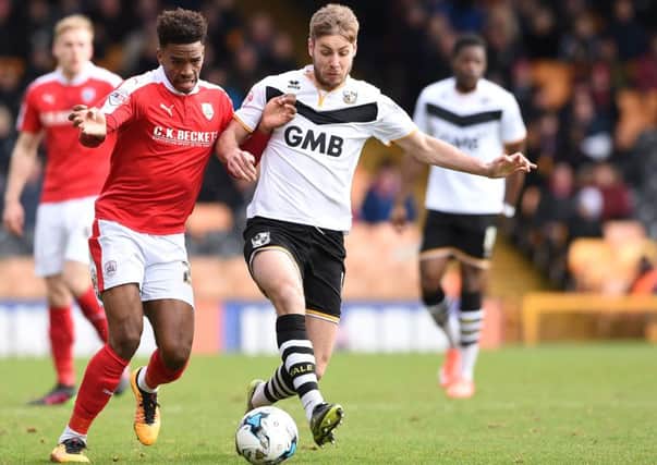 Port Vale's Ajay Leitch-Smith tussles with Barnsley 's Ivan Toney.  

Skybet league 1