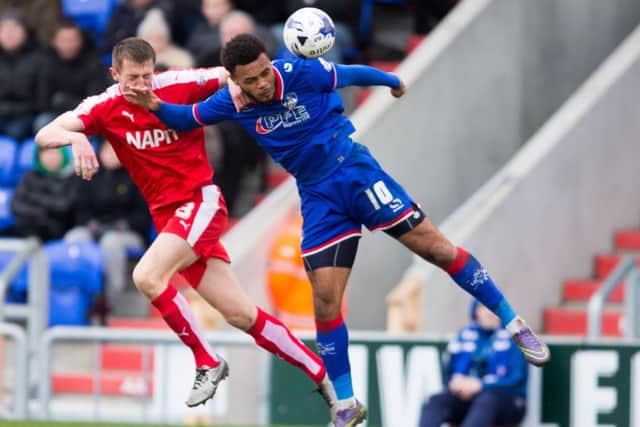 Oldham vs Chesterfield - Tom Anderson battles for the ball - Pic By James Williamson