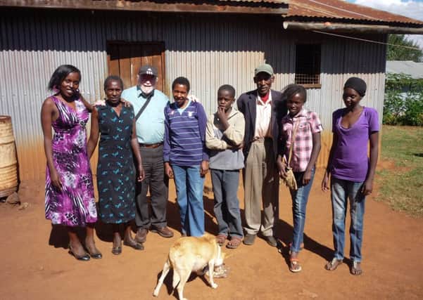 Dave Ling, from Crookes, Sheffield, with Ruth Wairimu and her family at their home in Nairobi, Kenya