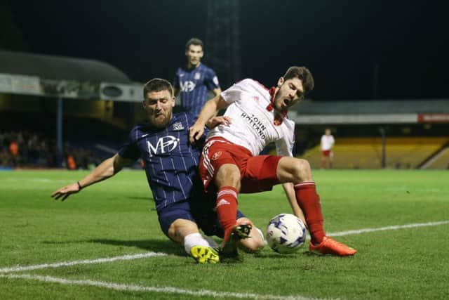 Southend's Gary Deegan tussles with Sheffield United's Ryan Flynn during the League One match at Roots Hall Stadium.  Photo: David Klein/Sportimage
