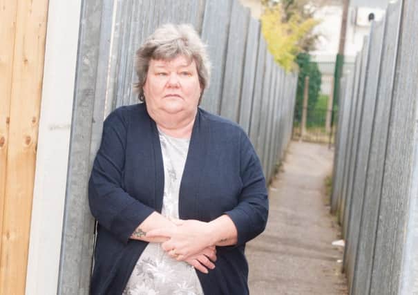 Resident Elaine Jarvill who wantsDoncaster Council to put street lighting around the alleyways that surround their homes at Balby
Picture Dean Atkins