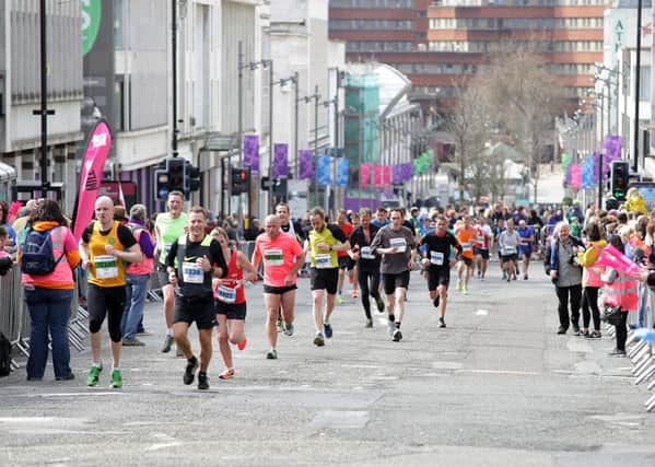 Runners slog up The Moor for the final stretch of last year's half marathon