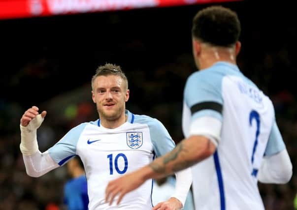 England's Jamie Vardy (left) celebrates scoring   with teammate Kyle Walker at Wembley. Photo: Mike Egerton/PA Wire