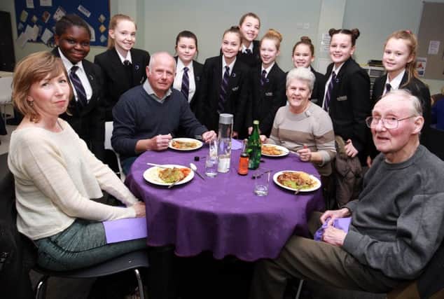 Students at Outwood Academy City held a special lunch for the community as part of The Link Community Centre Pilot. Morgan Starkes, 11, and Kay Heath are pictured getting the lunch ready.