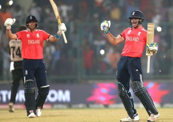 England's Jos Buttler, right, and teammate Joe Root celebrate reaching ICC Twenty20 2016 Cricket World Cup final