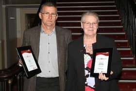 Jim Rust and Christine Wooldridge receive their awards for reaching 100 blood donations each.