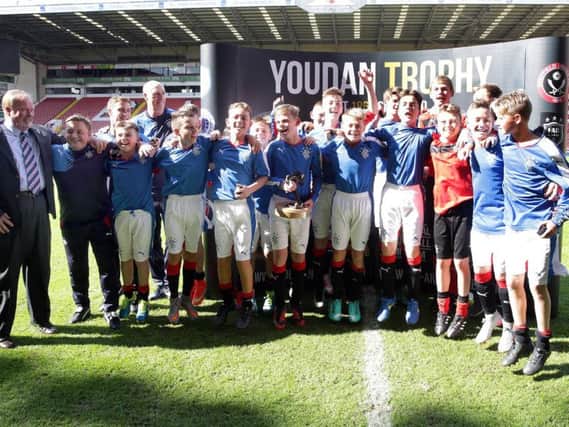 A jubilant Rangers FC after winning the Youdan Trophy inaugural final at Bramall Lane in 2015