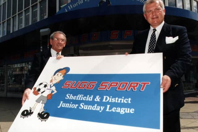 Tim Sugg (right), Chairman of Sugg Sport, and Mr C Pinder, League Chairman, unveil the new logo for the Sugg Sport Sheffield & District Junior Football League.