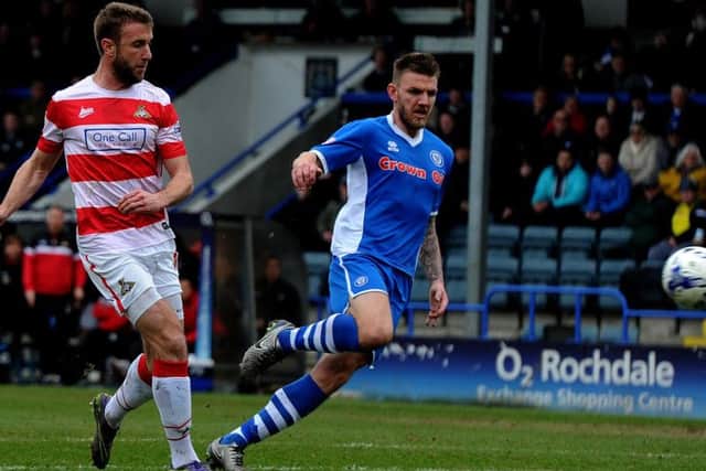 Andy Williams fires on goal against Rochdale