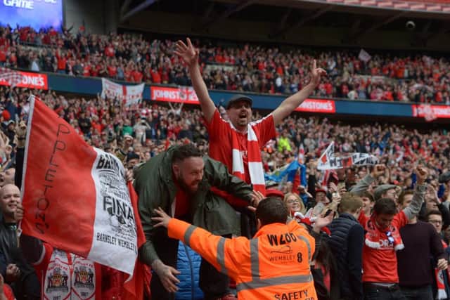 Barnsley fans celebrate at the final whistle. Picture by Howard Roe/AHPIX.com