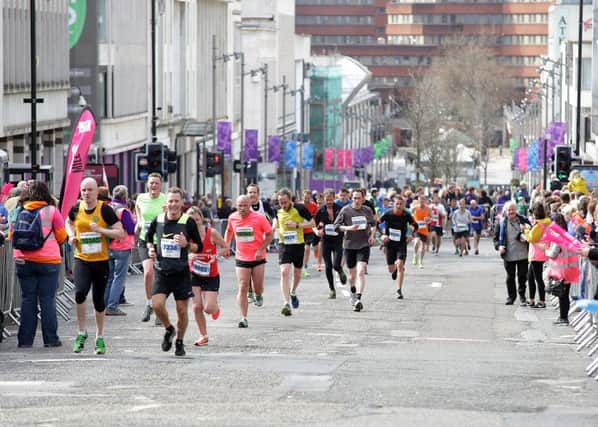 Runners slog up The Moor for the final stretch of last year's half marathon