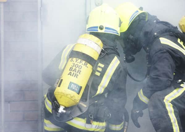 Stock images from South Yorkshire Fire Service - Firemen - car fire - fire hose - fire engine - smoke