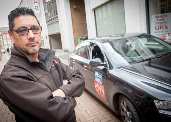 Taxi driver Ehsan Ulhaq who is complaining taxi drivers are still being issued Sheffield bus lane fines