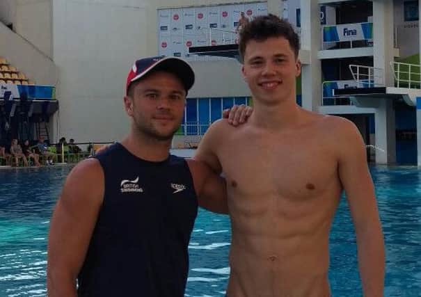 Freddie Woodward, right,  with his coach Tom Owens at the Rio pool