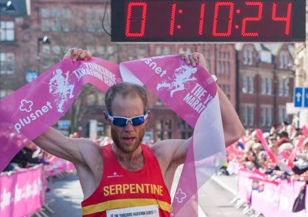 Serpentine's John Franklin crosses the line to win the PlusNet orkshire Half Marathon in Sheffield