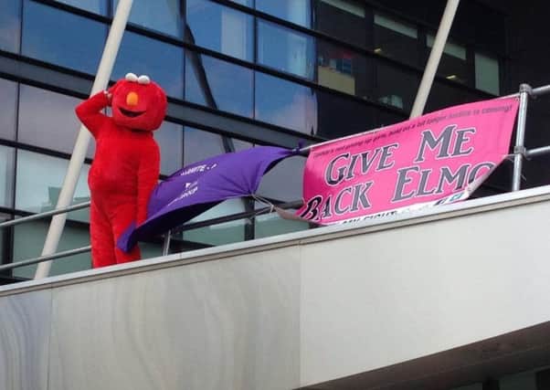 New Fathers 4 Justice campaigner and Sheffield Brightside and Hillsborough by-election candidate Bobby Smith dressed as Elmo on the roof of Stevenage police station.