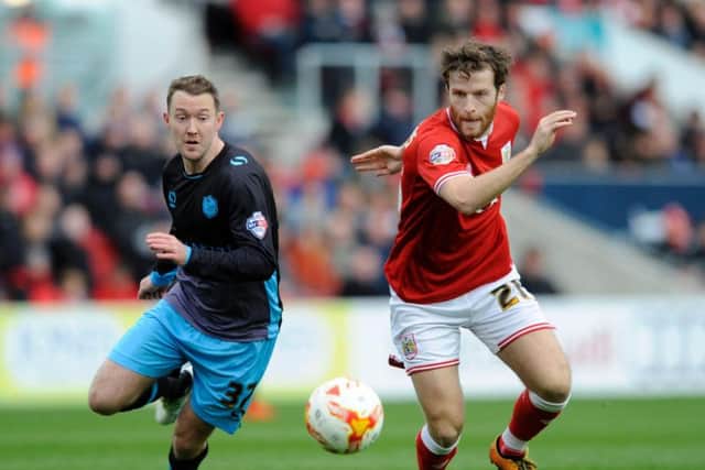Aiden McGeady competes with Marlon Pack for the ball.