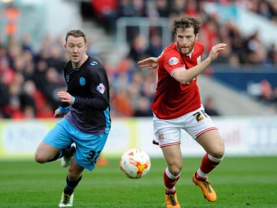 Aiden McGeady competes with Marlon Pack for the ball.
