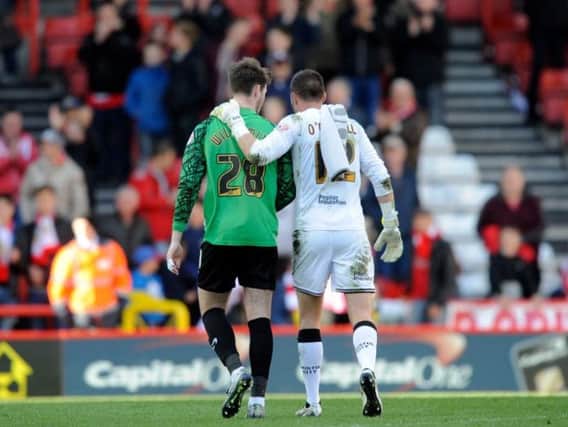 Former Wednesday stopper Richard O'Donnell consoles Owls keeper Joe Wildsmith