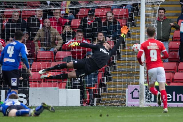 Chesterfield keeper Tommy Lee is unable to stop Adam Hammill'sequaliser for Barnsley