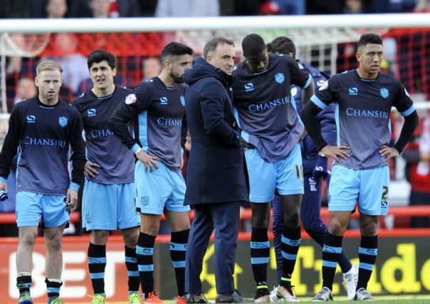 Carlos Carvalhal talks to his players on the pitch