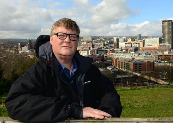 Brian Holmshaw, one of the conference organisers, in the  Cholera Monument grounds with the city behind him.