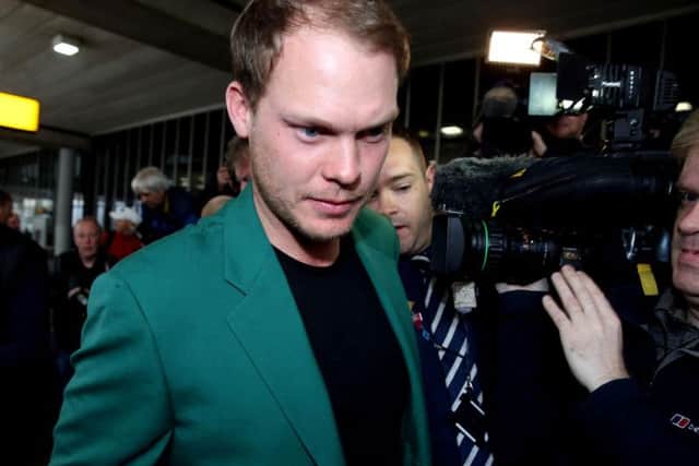 Cameramen surround new Masters champion Danny Willett as he arrives in Manchester. PICS: PA