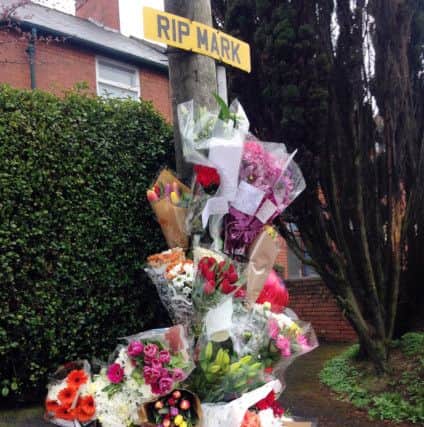 Floral tributes at the scene of the accident.