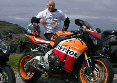 Mark with one of his 14 motorbikes.