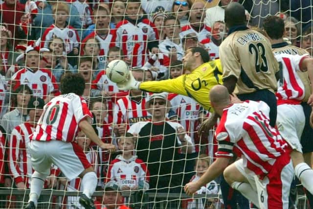 David Seaman stretches to deny Paul Peschisolido at Old Trafford in 2003