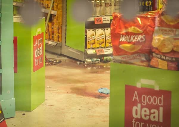 Blood covers the floor of the Co-Op in Gleadless, Sheffield, after several officers were injured by a male when they attempted to arrest him. Picture: Ross Parry Agency