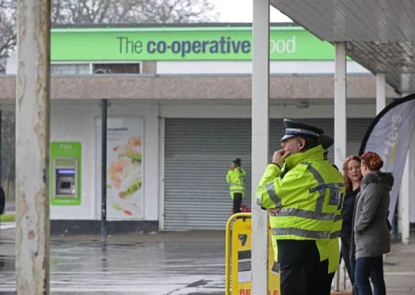 Police patrol around the Co-operative store at Newfield Green after the incident last night. Picture: Marie Caley NSST Newfield Green MC 14