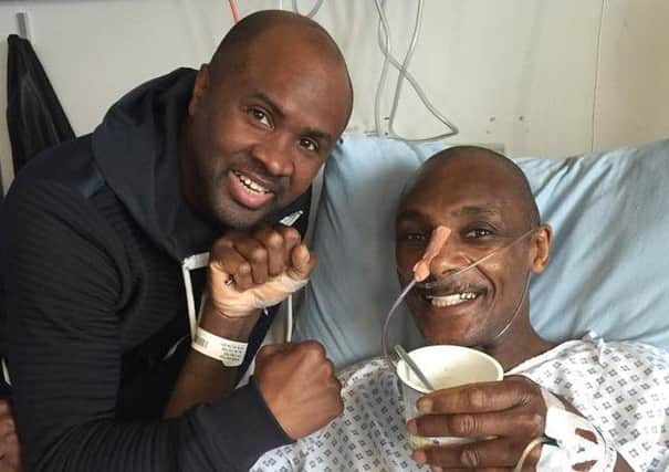 Sheffield-tranied boxer Herol Graham in hospital with friend and fellow boxer Colin McMillan.