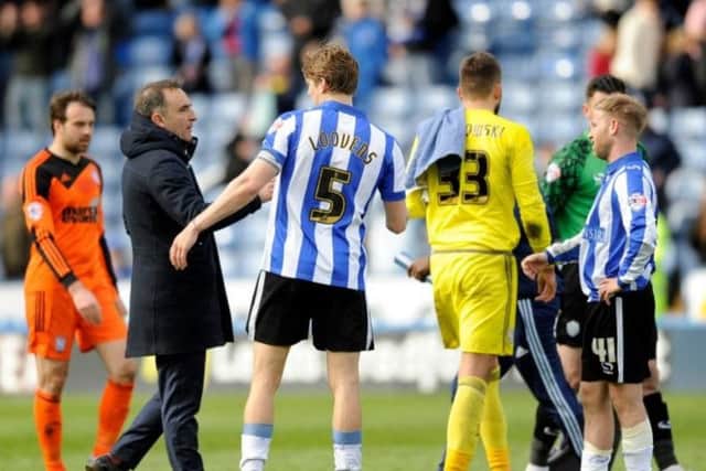 Carlos Carvalhal shakes hands with his players following the 1-1 draw with Ipswich at Hillsborough