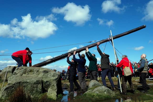 The new Stanage Pole: the pole is pulled into place supervised by designer Chris Wells (far right)