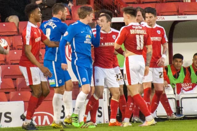 Players clash after the sending off of Chris Forrester