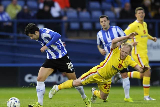 Owls Alex Lopez gets away from Dons Jonny Williams