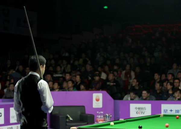 Ding Junhui faces his legion of Chinese fans, armed only with his trusty snooker clue