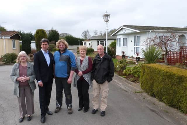 Ed Miliband pictured with Philip Horberry, who works at the site, and residents, at Wittsend Park, Arksey