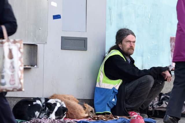 A Big Issue seller on the streets of Sheffield. Picture: Andrew Roe