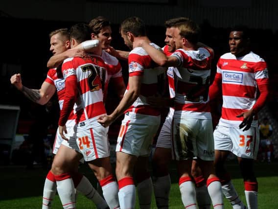 Rovers' players celebrate Tommy Rowe's opener. Photo: Andrew Roe
