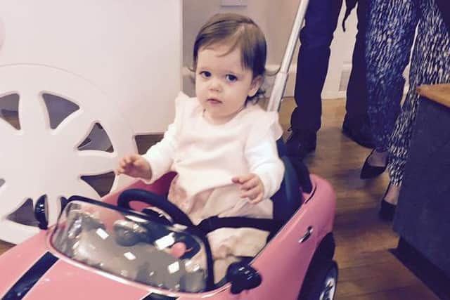 Freya McBride, who has kawasaki disease, at her first birthday party fundraiser.